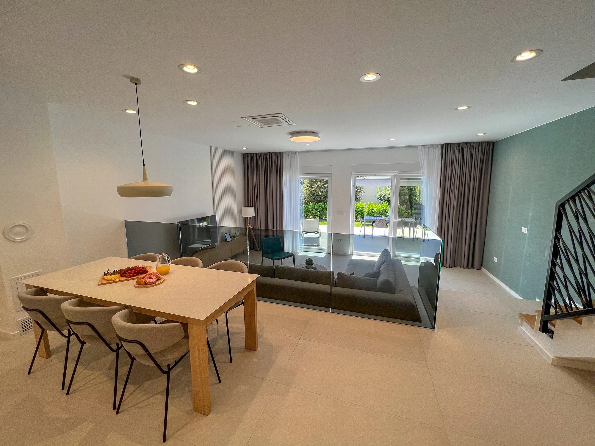 Open-plan dining and living space opening onto the terrace