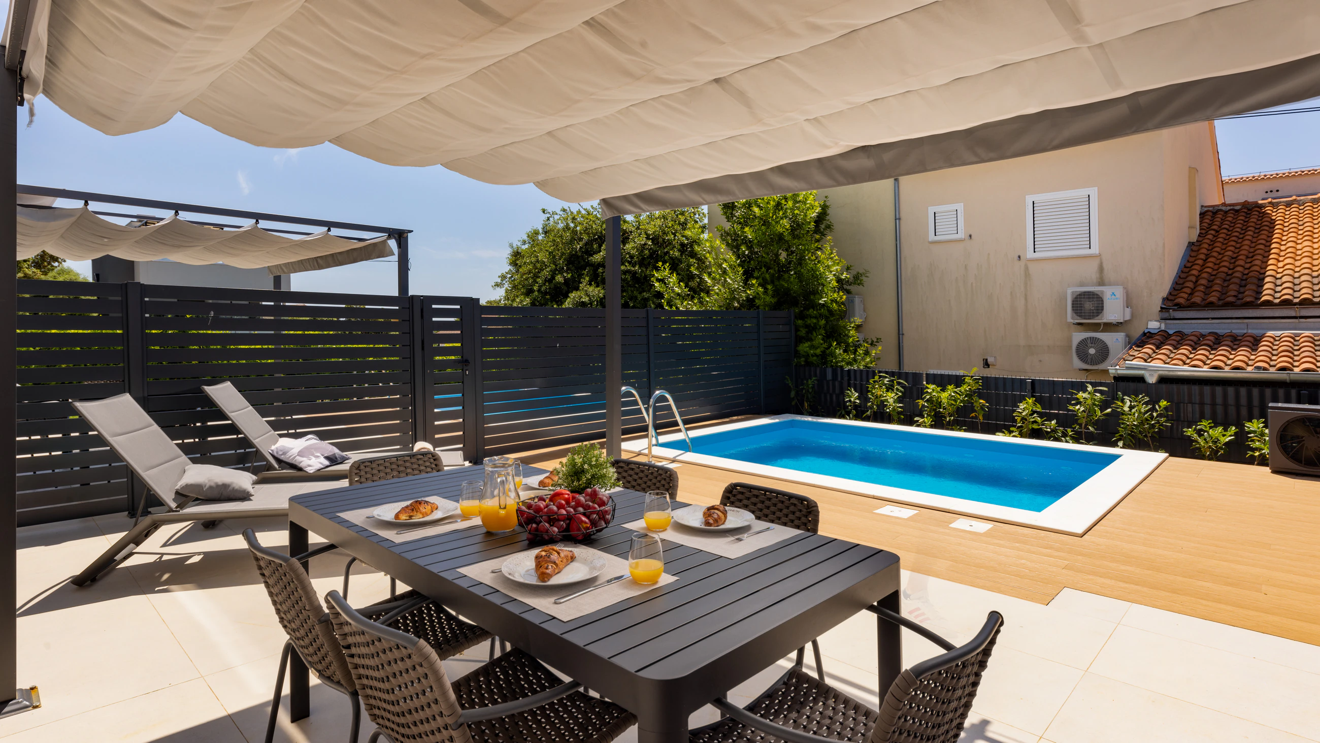 Private pool and apartment exterior at Three-Bedroom Apartment with Private Pool Near the Sea